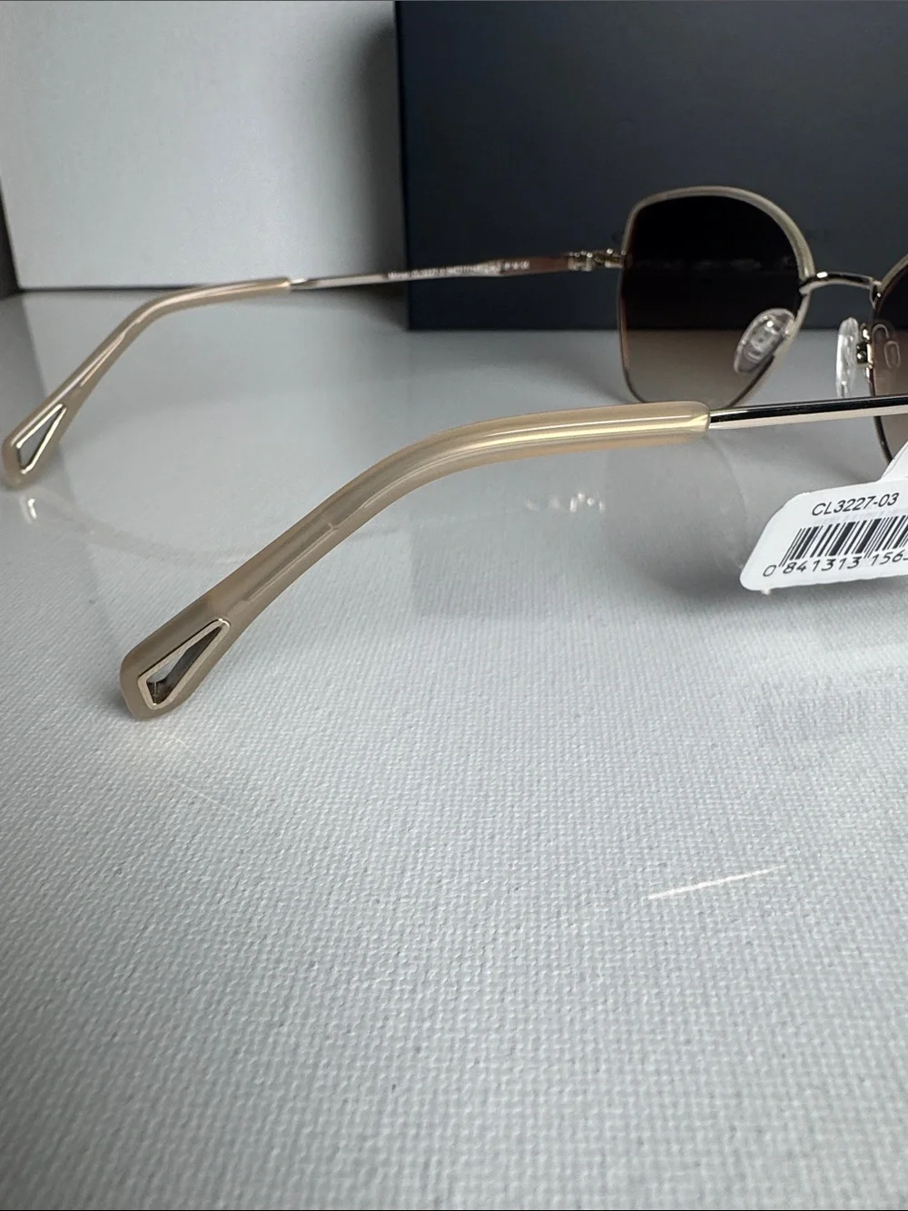 Carolina Herrera Gold Frame Sunglasses with Brown Gradient Lenses
